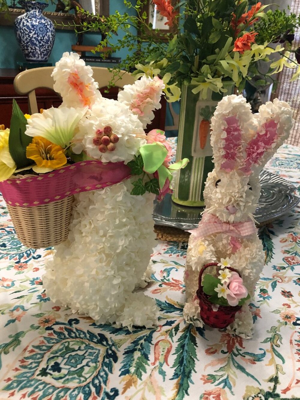 Two white faux Hydrangea rabbits